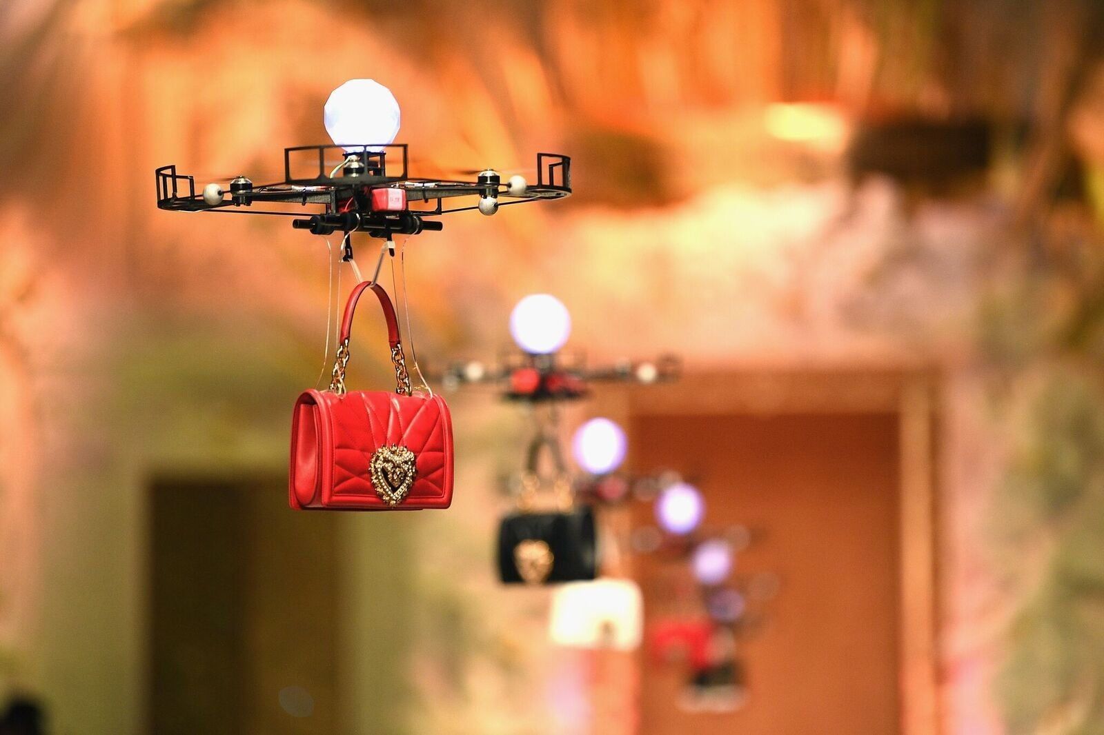 Dolce & Gabbana is using drones to model its handbags at Milan Fashion Week.